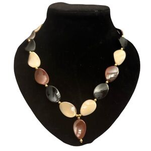 Vintage style disc necklace with gold accents.